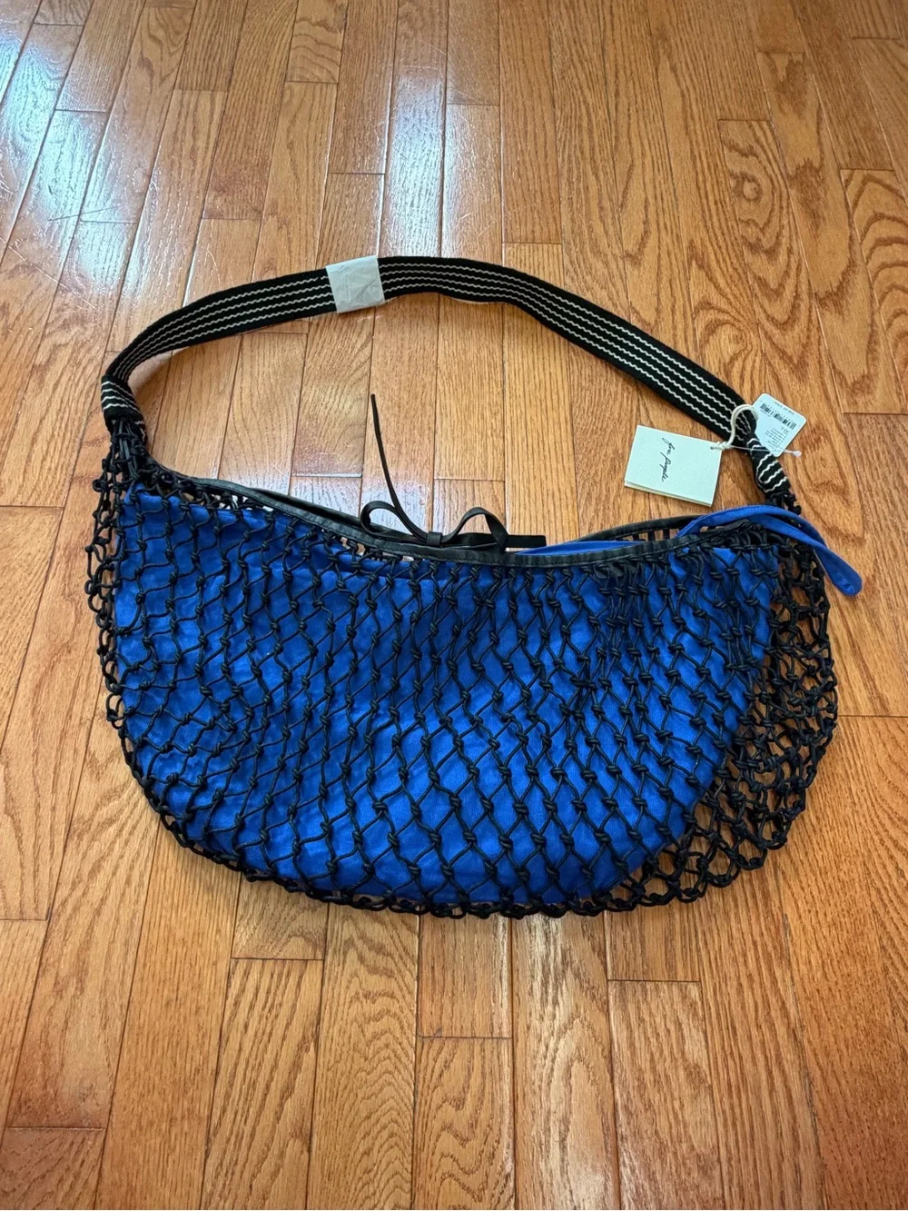 NWT new free people silver springs sling bag black netting netted blue
